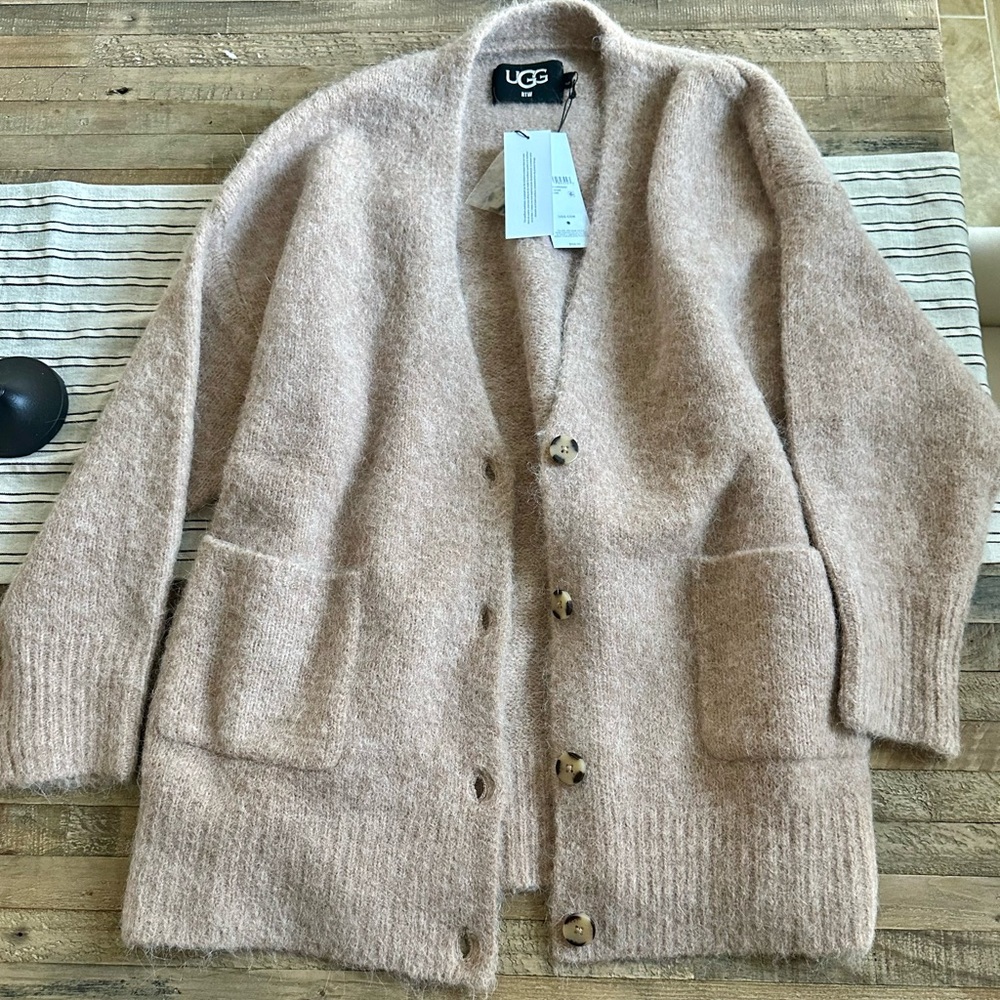 Ugg brand new sweater with tags original prize is 168.00